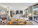 Spacious living room is filled with natural light and showcases modern furniture and stylish decor at 6415 Midnight Pass Rd # 211, Sarasota, FL 34242