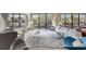 Bright living room with sliding doors to a balcony, features modern furnishings, and beautiful views at 6415 Midnight Pass Rd # 211, Sarasota, FL 34242