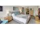 Cozy main bedroom featuring decor, area rug, lamps, and closet access at 6415 Midnight Pass Rd # 211, Sarasota, FL 34242