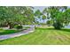 Enjoy the waterfront park with lush landscaping and mature trees, perfect for a relaxing day outdoors at 6415 Midnight Pass Rd # 211, Sarasota, FL 34242