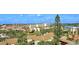 Scenic aerial view of the property, showcasing lush landscaping and nearby cityscape at 6415 Midnight Pass Rd # 910, Sarasota, FL 34242