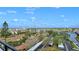 Expansive view from balcony showcasing a city skyline, waterway, and lush greenery at 6415 Midnight Pass Rd # 910, Sarasota, FL 34242