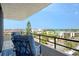 Relaxing balcony with chairs and a view of the city skyline and the water at 6415 Midnight Pass Rd # 910, Sarasota, FL 34242