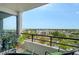 Relaxing balcony with comfortable seating and stunning views of the surrounding neighborhood at 6415 Midnight Pass Rd # 910, Sarasota, FL 34242