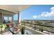 Balcony seating with views of the city and intercoastal waterway from a top floor condo at 6415 Midnight Pass Rd # 910, Sarasota, FL 34242