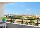 Balcony view of a community with a lake, pool, and nearby buildings at 6415 Midnight Pass Rd # 910, Sarasota, FL 34242