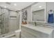 Updated bathroom featuring a modern vanity with beautiful countertops and a tiled shower at 6415 Midnight Pass Rd # 910, Sarasota, FL 34242