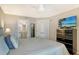 Comfortable bedroom with ensuite bathroom and dresser with TV, perfect for relaxing at 6415 Midnight Pass Rd # 910, Sarasota, FL 34242