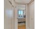 Bright bedroom showing access to a balcony and views beyond from inside a closet entrance at 6415 Midnight Pass Rd # 910, Sarasota, FL 34242