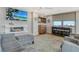Modern living room with fireplace, TV, bar and scenic view at 6415 Midnight Pass Rd # 910, Sarasota, FL 34242