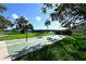 Shuffleboard area by the water with shade trees in a well maintained outdoor recreational area at 6415 Midnight Pass Rd # 910, Sarasota, FL 34242