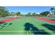 Well maintained outdoor tennis courts with lush green surroundings offer an active lifestyle at 6415 Midnight Pass Rd # 910, Sarasota, FL 34242