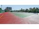 Scenic shot of outdoor tennis courts with lush green surroundings offer an active lifestyle at 6415 Midnight Pass Rd # 910, Sarasota, FL 34242