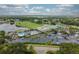 A great view of the community with golf course, pond, tennis courts, and large clubhouse at 6916 Stoneywalk Ct # 6916, Bradenton, FL 34203