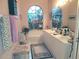 Bright bathroom with a soaking tub, double vanity, and decorative window at 6916 Stoneywalk Ct # 6916, Bradenton, FL 34203