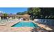 Relax by the sparkling community pool with ample seating and a covered lounge area at 6916 Stoneywalk Ct # 6916, Bradenton, FL 34203