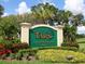 Entrance to Tara Golf & Country Club, featuring vibrant landscaping and a welcoming sign at 6916 Stoneywalk Ct # 6916, Bradenton, FL 34203