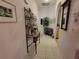 Inviting entryway with tiled floors, decorative shelving, and neutral walls creates a welcoming atmosphere at 6916 Stoneywalk Ct # 6916, Bradenton, FL 34203