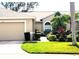 Charming home with a well-kept lawn, tasteful landscaping, and a welcoming driveway offers curb appeal at 6916 Stoneywalk Ct # 6916, Bradenton, FL 34203