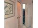 Hallway with bi-fold closet doors and decorative artwork at 6916 Stoneywalk Ct # 6916, Bradenton, FL 34203