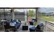 Relax on the covered outdoor patio featuring comfortable seating, perfect for enjoying the fresh air and beautiful views at 6916 Stoneywalk Ct # 6916, Bradenton, FL 34203