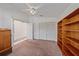 This bedroom features a built-in shelf, ceiling fan, closet, and access to the bathroom at 7312 Eleanor Cir, Sarasota, FL 34243