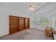 Bedroom with nice natural light, large built-in shelves, and a ceiling fan at 7312 Eleanor Cir, Sarasota, FL 34243
