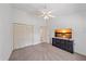 A secondary bedroom has a closet and TV, and is well-lit by a center ceiling fan with lighting at 7312 Eleanor Cir, Sarasota, FL 34243