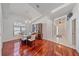 Elegant dining room with hardwood floors, a chandelier, and views of the home's bright and airy interior at 7312 Eleanor Cir, Sarasota, FL 34243
