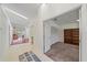 Bright entryway featuring white tile, skylights, and an open layout leading to the living areas and bedrooms at 7312 Eleanor Cir, Sarasota, FL 34243