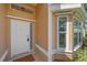 Close-up of the front door and bay window, highlighting the architecture and inviting entryway at 7312 Eleanor Cir, Sarasota, FL 34243