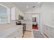Bright kitchen featuring stainless steel appliances and white cabinets at 7312 Eleanor Cir, Sarasota, FL 34243