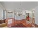 Bright living area with hardwood floors, neutral paint, and open floor plan to the kitchen at 7312 Eleanor Cir, Sarasota, FL 34243