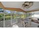 Covered, screened lanai with outdoor seating and water view at 7312 Eleanor Cir, Sarasota, FL 34243