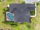 Wide aerial shot highlighting the location, surrounding woods, and many other homes in the distance at 7601 226 E St, Bradenton, FL 34211
