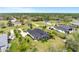 Aerial view showcasing the property, its landscaping, and the surrounding neighborhood at 7601 226 E St, Bradenton, FL 34211