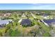 Aerial view displays the expansive landscape and neighborhood surrounding the beautiful property at 7601 226 E St, Bradenton, FL 34211