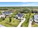 Stunning aerial view of an estate home with lush landscaping and an expansive driveway leading to the residence at 7601 226 E St, Bradenton, FL 34211