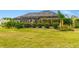 Landscaped backyard features a screened-in pool, creating an inviting outdoor living area at 7601 226 E St, Bradenton, FL 34211