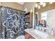 Bathroom featuring modern fixtures, vanity with countertop, and shower with decorative curtain at 7601 226 E St, Bradenton, FL 34211