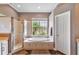 This bathroom boasts a walk-in shower, bathtub, and large window view to the property's exterior at 7601 226 E St, Bradenton, FL 34211