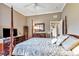 This bedroom features a four poster bed and a vintage wooden dresser with a fan at 7601 226 E St, Bradenton, FL 34211