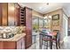 Bright eat-in kitchen area featuring wooden table and chairs at 7601 226 E St, Bradenton, FL 34211