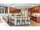 Gourmet kitchen boasts granite countertops, wood cabinets, a breakfast bar and stainless steel appliances at 7601 226 E St, Bradenton, FL 34211