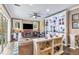 Inviting living room featuring a fireplace, entertainment center and serene backyard views at 7601 226 E St, Bradenton, FL 34211