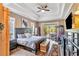 A spacious main bedroom has tray ceilings and an exit to a screened patio area at 7601 226 E St, Bradenton, FL 34211