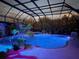 Screened-in pool and jacuzzi area, surrounded by lush landscaping, provides a private oasis at 7601 226 E St, Bradenton, FL 34211