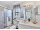 Clean bathroom with a shower and tub combination and a spacious vanity with ample storage at 801 Montrose Dr # 202, Venice, FL 34293