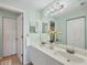 Bright bathroom with double sink vanity and large mirror, offering ample space and modern fixtures at 801 Montrose Dr # 202, Venice, FL 34293