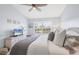 Bedroom features beachy decor, large window, ceiling fan, and wicker furniture at 801 Montrose Dr # 202, Venice, FL 34293